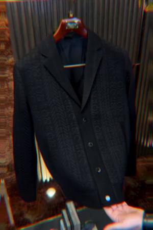 black single-breasted casual blazer with a textured pattern.