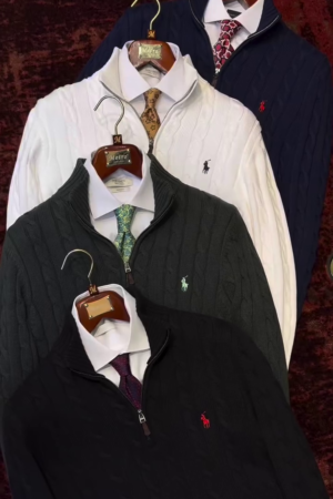 navy blue cable-knit cotton quarter-zip sweater.